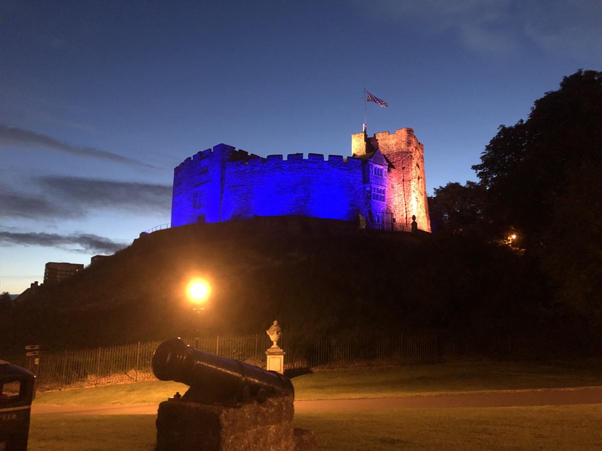 Tamworth castle lit up blue and yellow