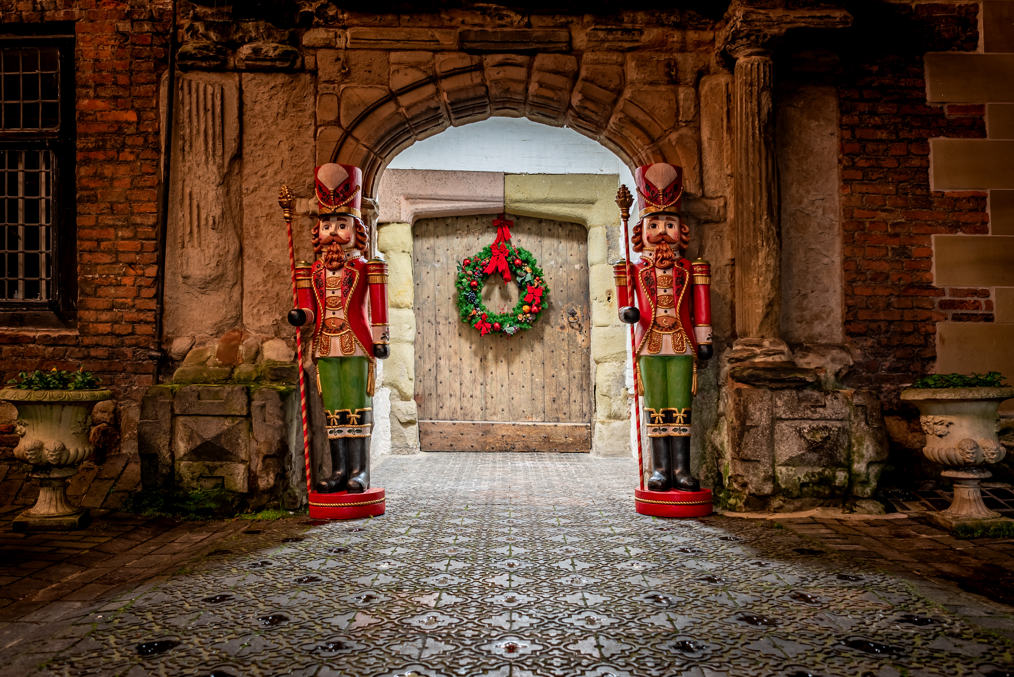 castle door at Christmas with nutcracker statues