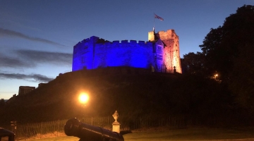 Tamworth castle lit up blue and yellow