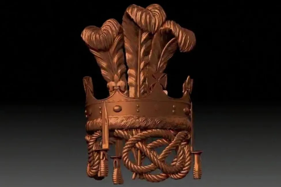 image of the proposed monument. It is bronze with rope notes on the bottom, a crown and feathers on the top.