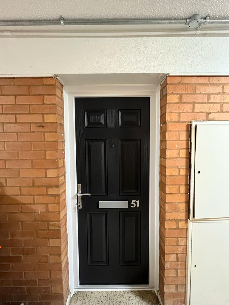 A new fire door, black, from the front