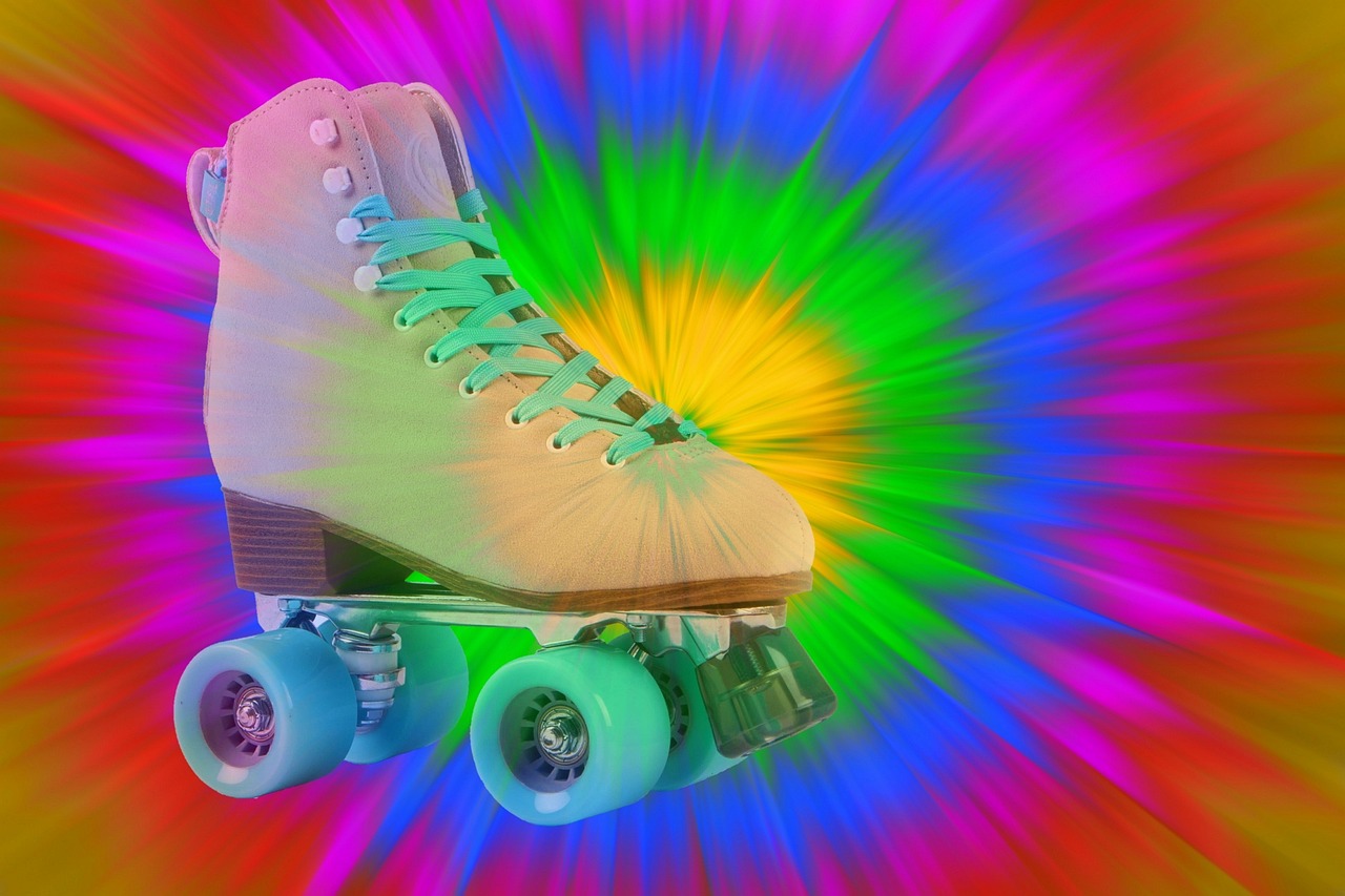 picture of a pair of white roller skates and a bright coloured background