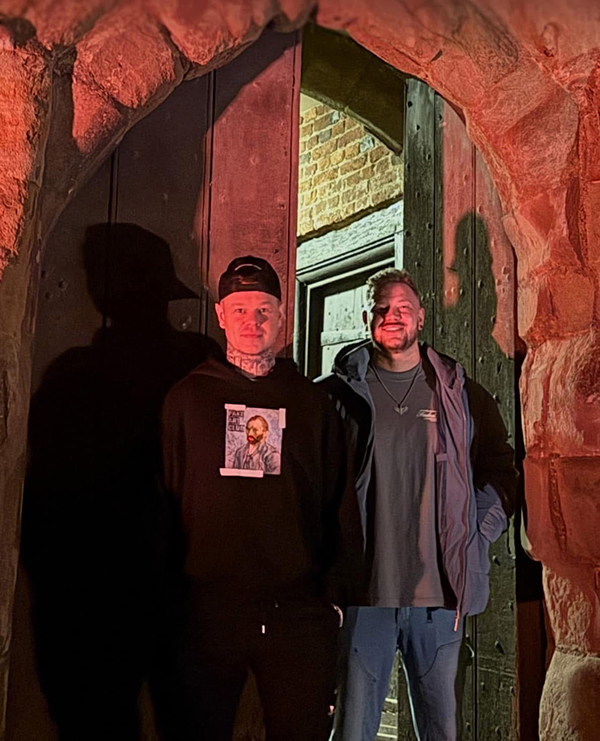 two ghost hunters in the castle doorway