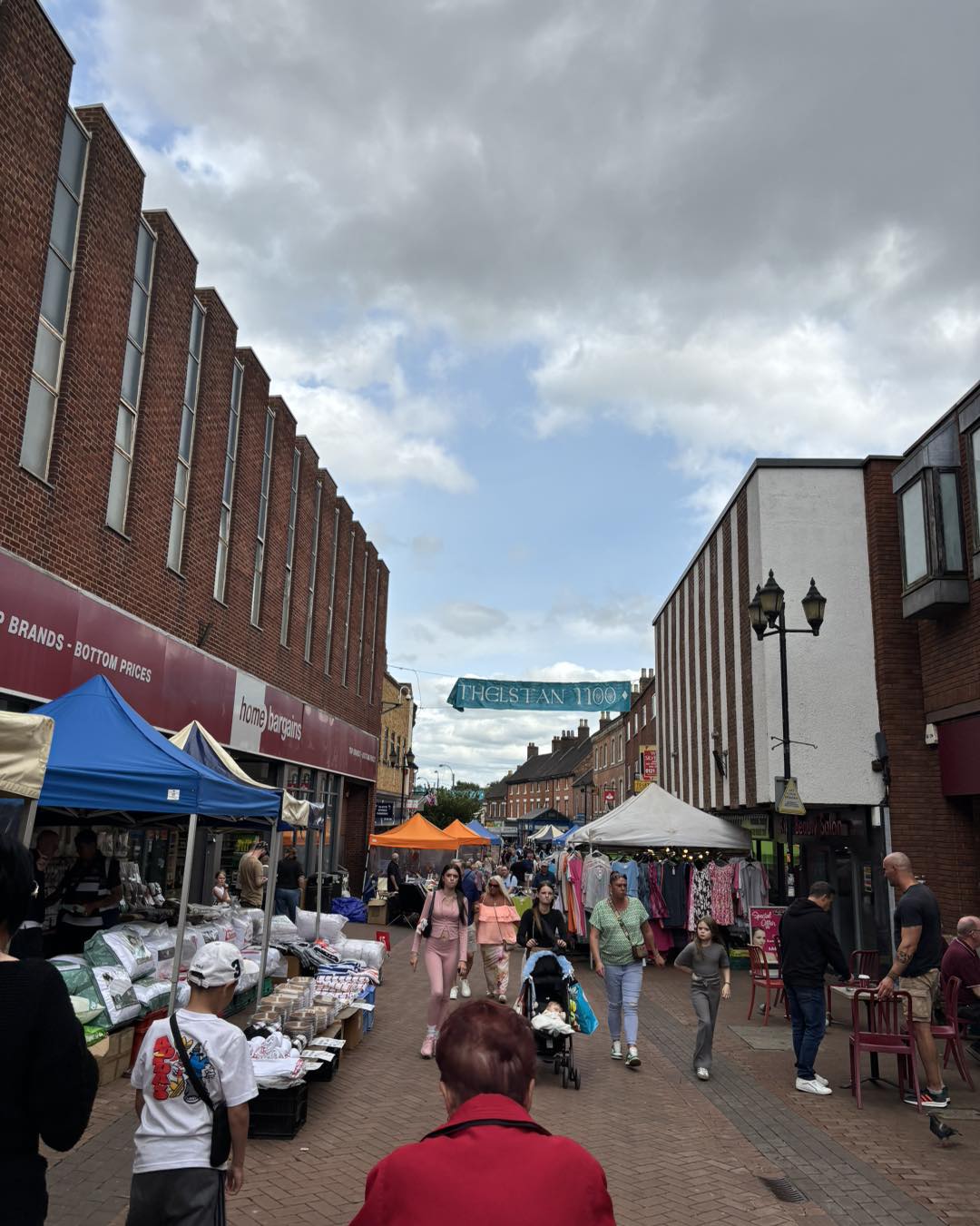 street with market stalls and people