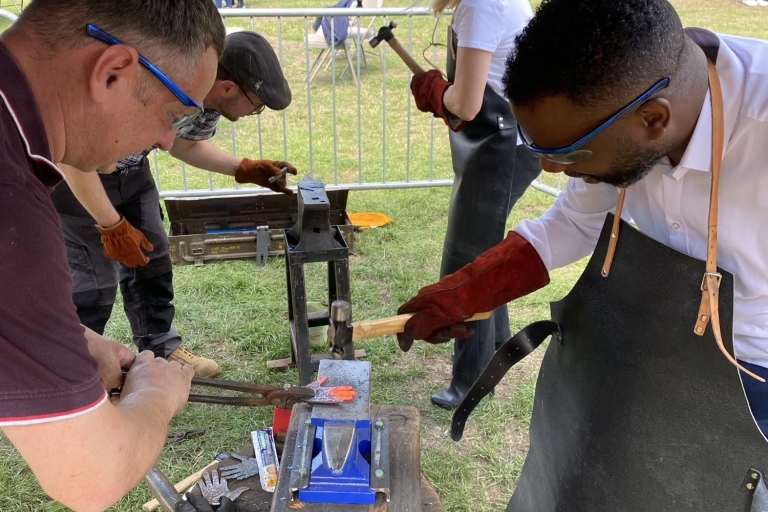 People in a blacksmith workshop