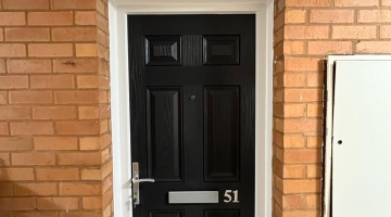 A new fire door, black, from the front