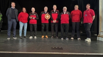 group photo on the Assembly rooms stage with a football shield