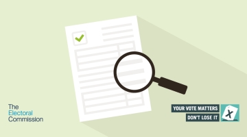 A light green background with a piece of paper and a magnifying glass