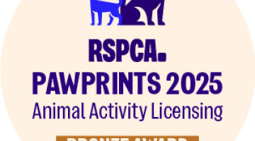 Bronze paw print award logo